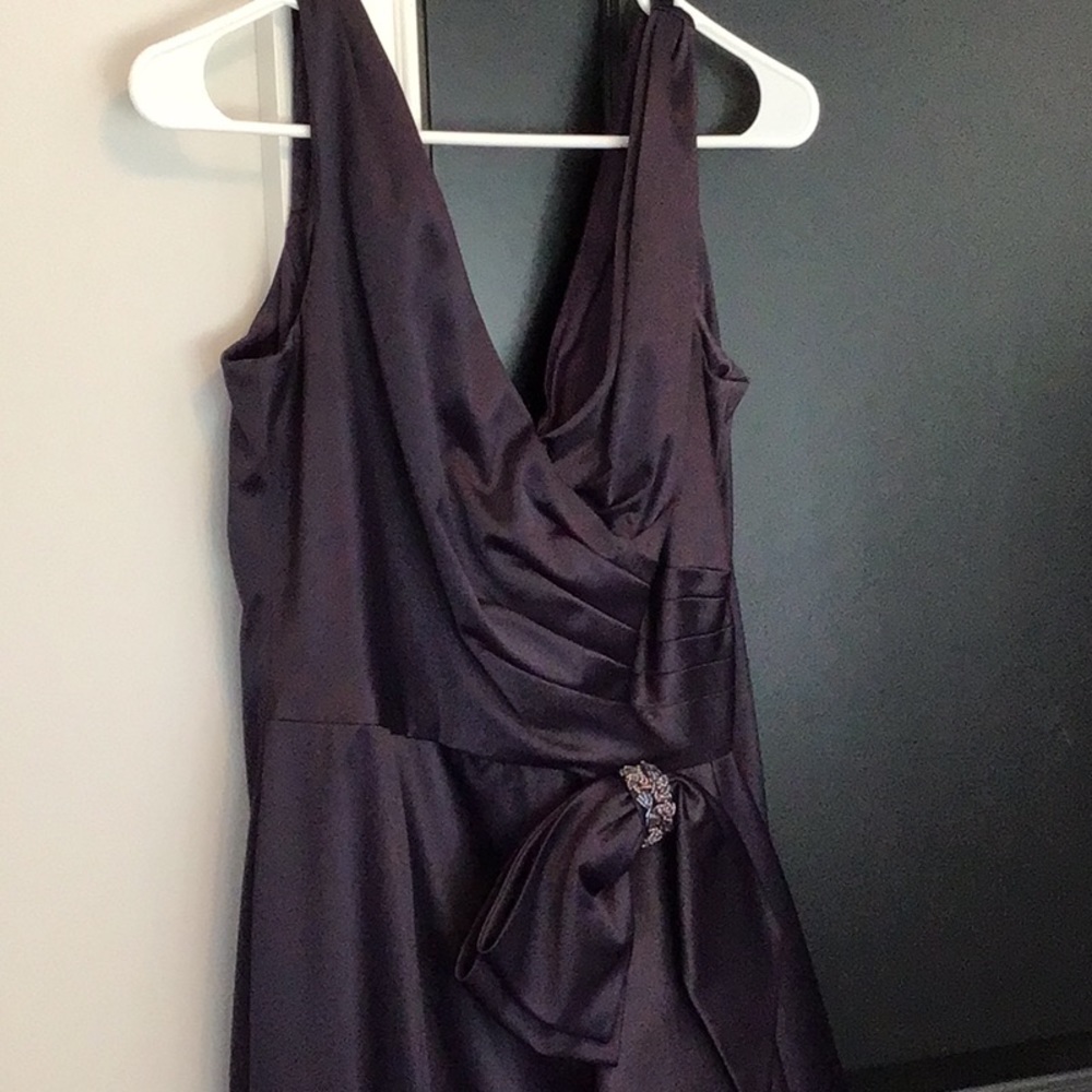 Black tie dressing.  Elegant gown with side bow and draping
